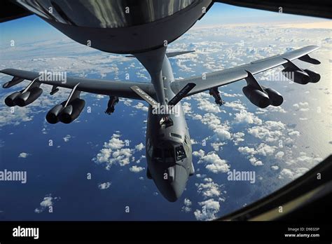 A KC 135 Stratotanker Aircraft Refuels A B 52 Stratofortress Aircraft