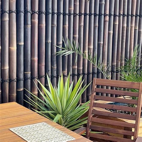 These Fence Screens Are Constructed With Java Black Half Round Poles