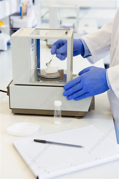 Scientist Weighing Out A Chemical Sample Stock Image C036 8996