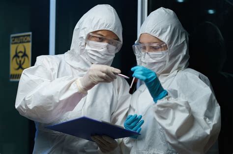 Premium Photo Scientists Wearing Medical Masks And Safety Glasses