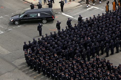 A Sea of Blue and Mourning at an Officer’s Funeral - The New York Times