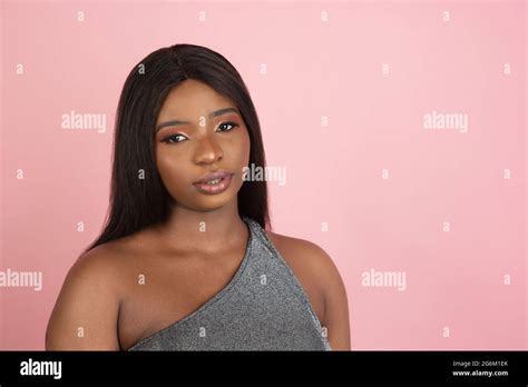 African Young Womans Portrait On Pink Studio Background Concept Of