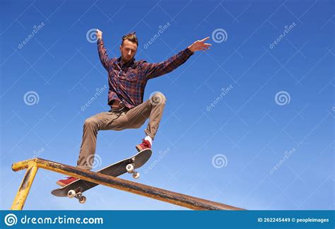 Like A Pro A Skateboarder Performing A Trick On A Rail Stock Image