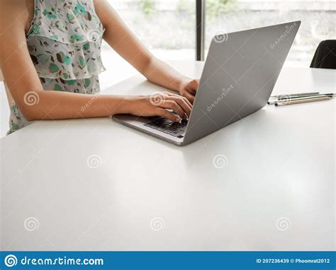 Woman Sitting At Desk And Working At Computer Hands Close Up