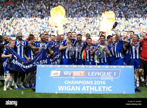 Wigan Athletic Celebrate With The Sky Bet League One Trophy After