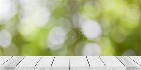 Empty White Wood Table Top With Blur Green Bokeh Background Stock Image