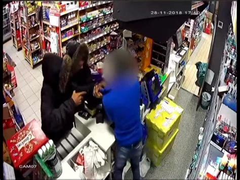 Terrifying Cctv Shows Pair Burst Into Shop And Threaten Staff Member