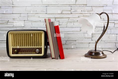 White Wooden Desk With A Few Books A Classic Table Lamp And A Vintage