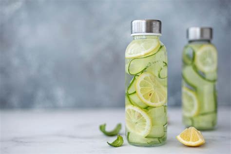 Premium Photo Detox Water With Cucumber Lemon And Mint In A Glass Bottle