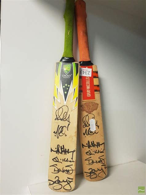 Lot - Signed Miniature Cricket Bats