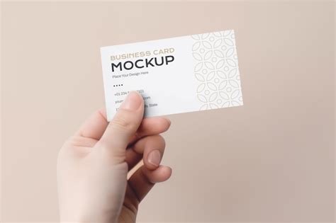 Premium PSD A Hand Holding A Business Card Mockup