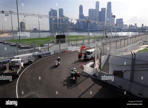 People prepare the track for the Formula 1 Singapore Grand Prix in Singapore, Singapore, 23 ...