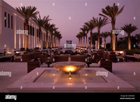 The Long Pool, The Chedi Muscat hotel at dusk, Muscat, Masqat, Oman ...