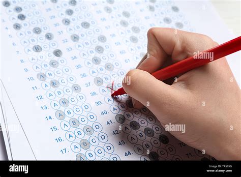 Teacher Checking Answer Sheet After Exam Closeup Stock Photo Alamy