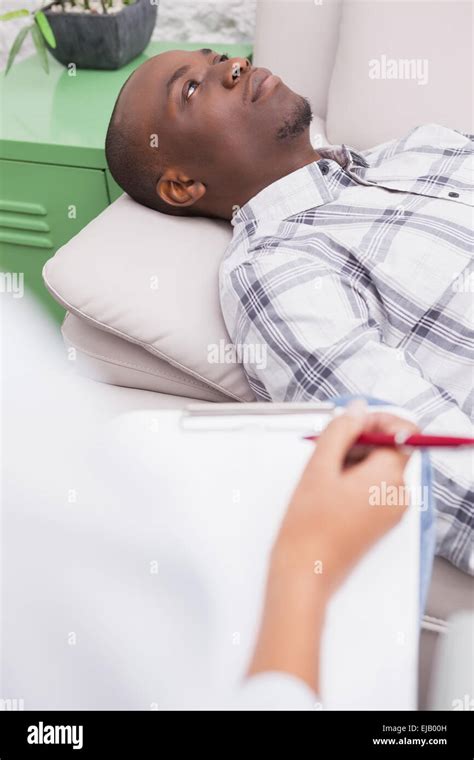 Man Lying On Sofa Talking To His Therapist Stock Photo Alamy