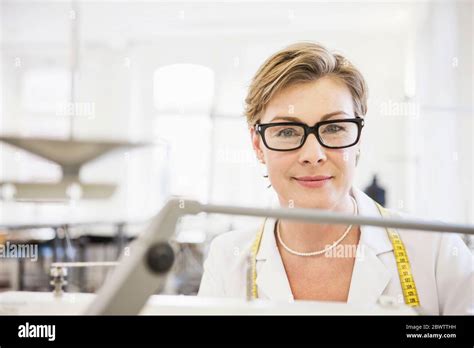 Portrait Of Smiling Seamstress In A Tailor Shop Stock Photo Alamy