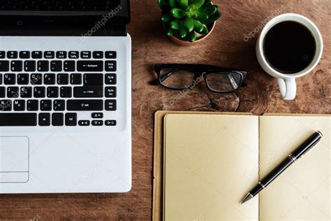 Laptop And Cup Of Coffee On Old Wooden Table Stock Photo Kitzcorner