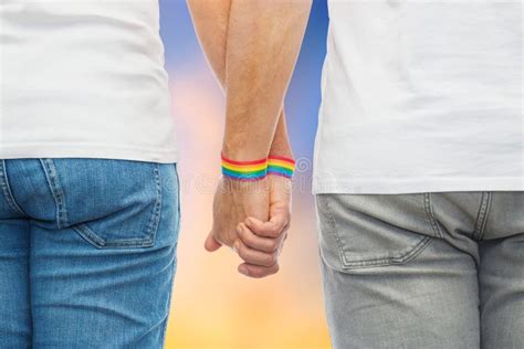 Male Couple With Gay Pride Rainbow Wristbands Stock Photo Image Of