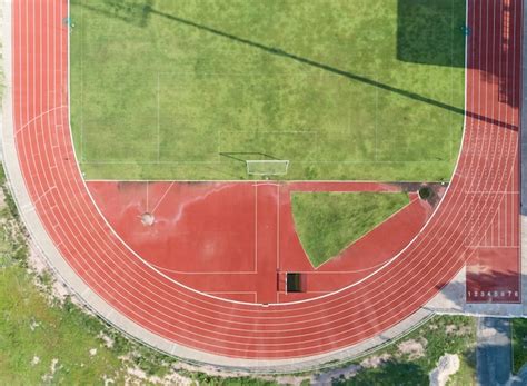 Premium Photo Aerial View On Half Of Soccer Field Football Field With Numbers On Red Running