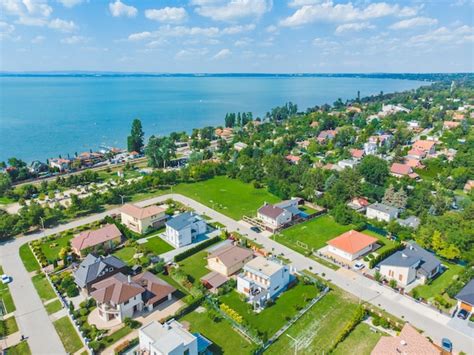 Premium Photo Aerial View Of Village Near Big Lake