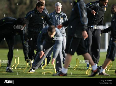 Manchester City Manager Mark Hughes Watches His Players During Training