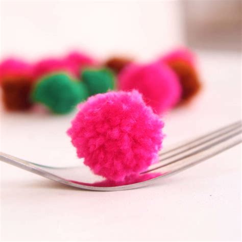 How to make tiny pom poms | FaveCrafts.com