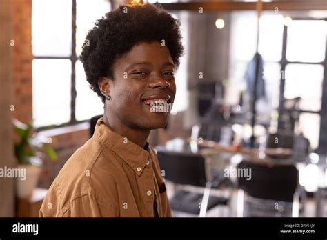 Portrait Of Relaxed Happy African American Man Laughing At Home Stock