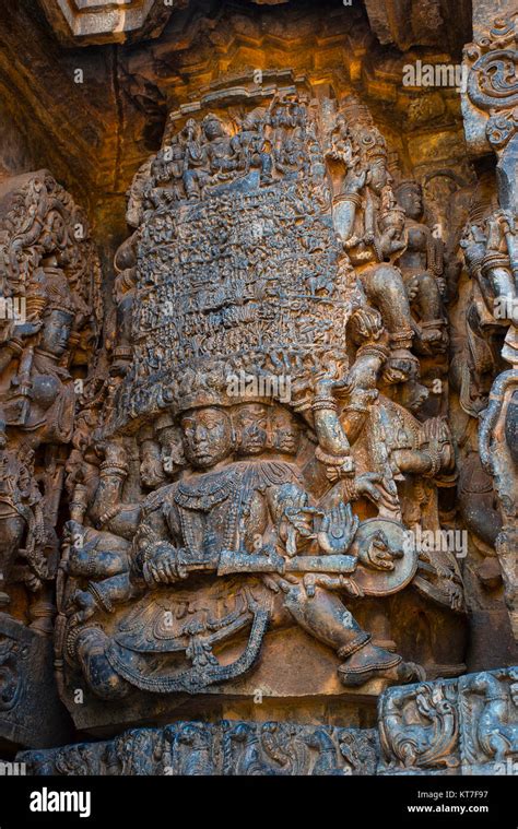 Ravana lifting Mount Kailasha. Shiva and Parvati at the top. Hoysalesvara Temple, Halebid ...