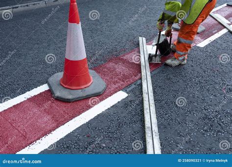 Road Workers Applying Hot Melt Traffic Resistant Paint For White