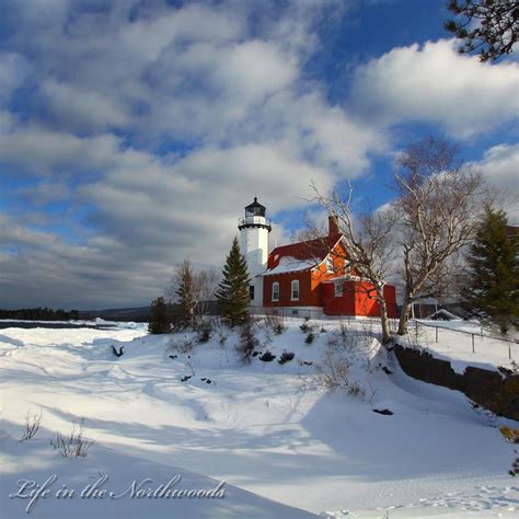 Eagle Harbor Lighthouse On The Shores Of Lake Superior In The Upper