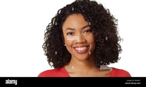 Portrait Of Smiling Black Female With Curly Hair On White Background