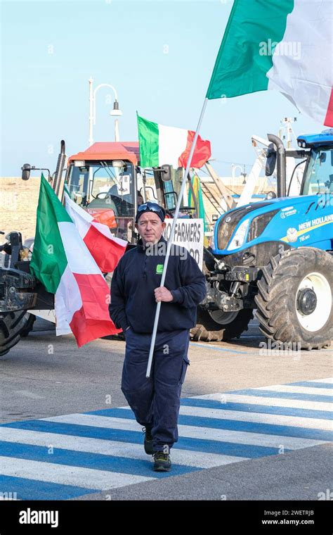 A Protester Holds The Italian Flag During The Demonstration The Waves