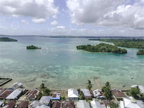 Aerial View Of Village Near Beautiful Beach With Small Island In The