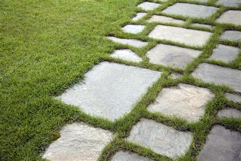 Grass And Stone Slabs — Stock Photo © Portokalis 5016543