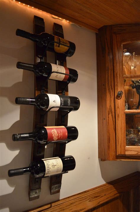 A Wine Rack With Several Bottles On It