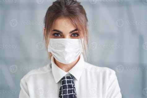 Businesswoman Wearing Mask Posing Over Modern Background 15866674 Stock