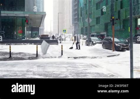 Moscow Russia February A Utility Worker Shovels Snow With A