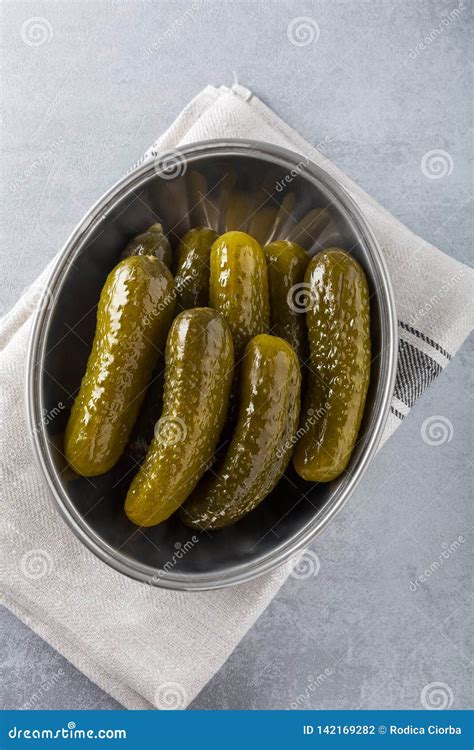 Pickled Gherkins With Mustard And Garlic On A Stone Rusty Background