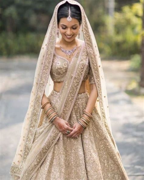 35 Gorgeous Golden Lehengas On Real Brides Wedbook Golden Bridal