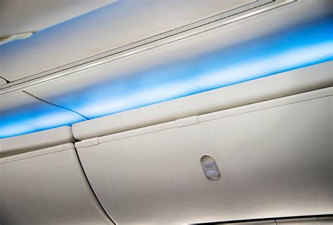 airplane luggage storage compartment cabin stock  pictures