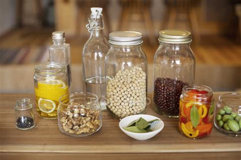 Close Up Of A Selection Of Condiments And Dried Pulses In Glass Jars — World Cuisine Vegan