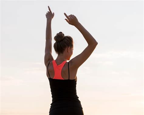 Premium Photo Back View Woman Holding Her Arms Up