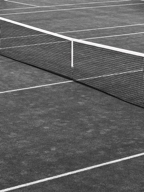 A Black And White Photo Of A Tennis Court