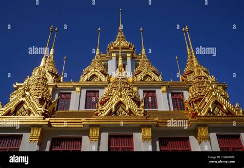 Detail Of The Golden Spires Against Blue Sky Of Loha Prasat Iron