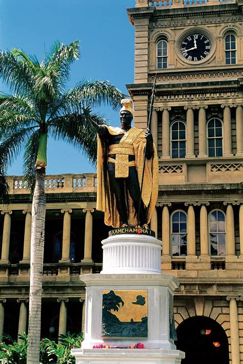 There Is A Statue In Front Of A Building