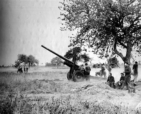 A 4 5 Inch Gun Of 211 Battery Royal Artillery Firing In Support Of