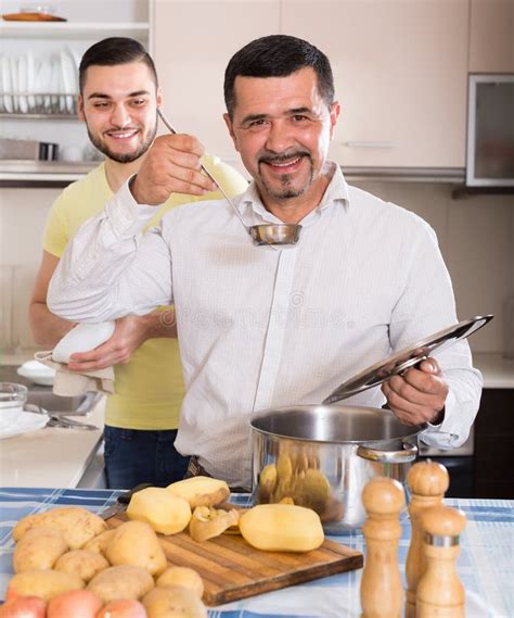 Two Men Cooking At Home Stock Photo Image Of Peel Help 80667778