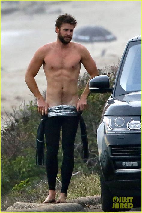 Liam Hemsworth Bares Ripped Abs While Stripping Out Of Wetsuit Photo 3796091 Liam Hemsworth