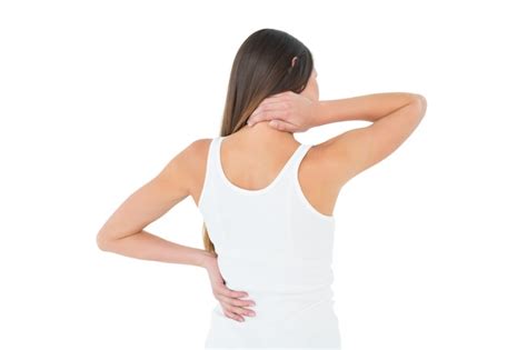 Premium Photo Rear View Of A Casual Woman Suffering From Neck Ache