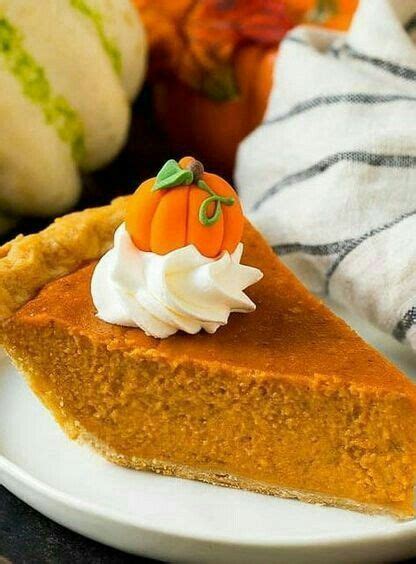 A Slice Of Pumpkin Pie On A White Plate